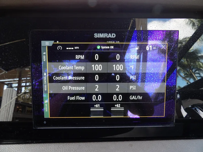 Slide: The Image of Simrad display on 2022 Sea Ray SDX 290 Outboard showing engine metrics. - 37
