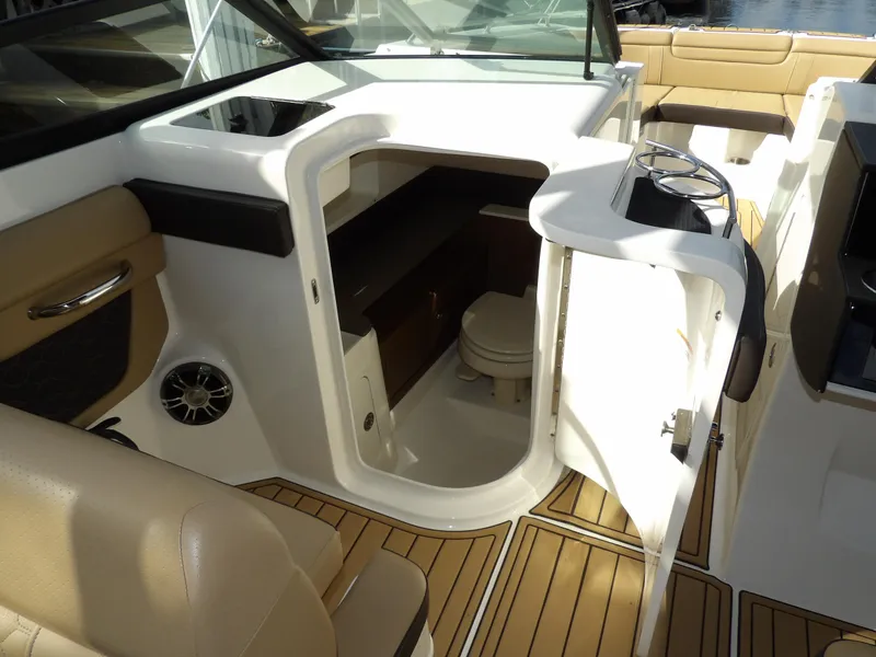 Slide: The Image of 2022 Sea Ray SDX 290 Outboard boat interior with open cabin door and seating. - 42