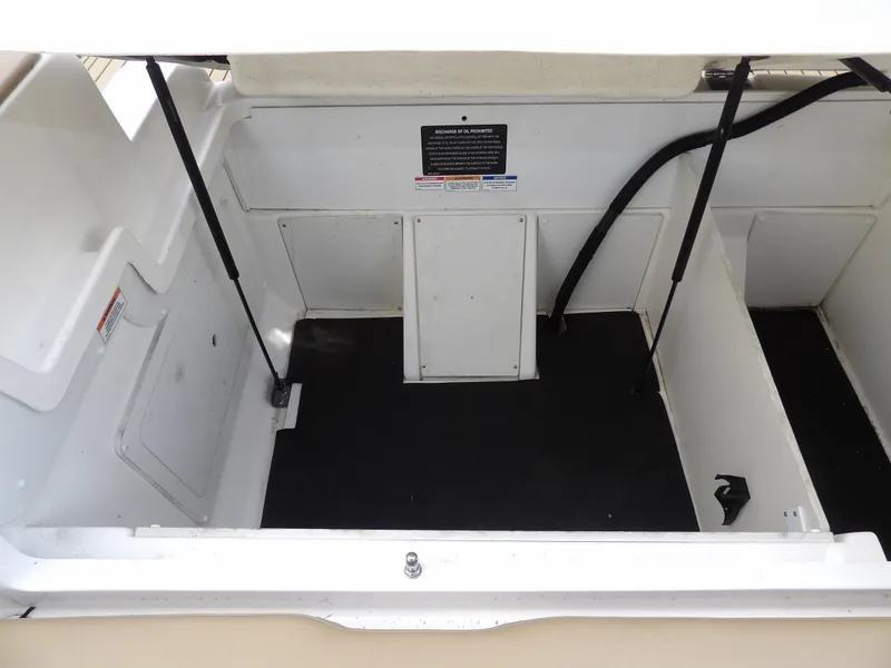 Slide: The Image of 2022 Sea Ray SDX 290 Outboard storage compartment, spacious and organized. - 48