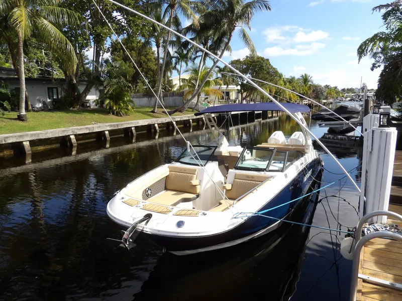 Slide: The Image of 2022 Sea Ray SDX 290 Outboard boat docked on a sunny canal. - 5