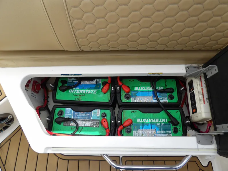 Slide: The Image of Battery compartment of 2022 Sea Ray SDX 290 Outboard with Interstate batteries. - 50