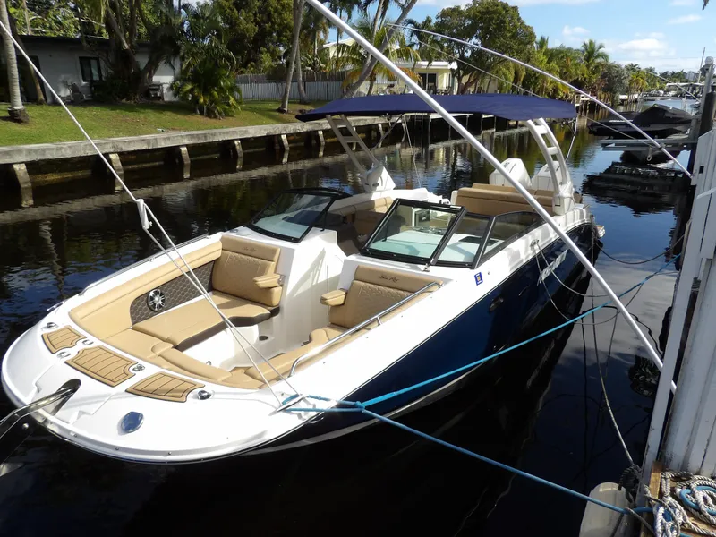 Slide: The Image of 2022 Sea Ray SDX 290 Outboard boat docked on a sunny canal. - 6