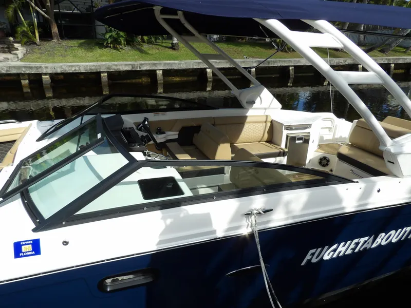 Slide: The Image of 2022 Sea Ray SDX 290 Outboard boat docked, featuring spacious seating and sleek design. - 8