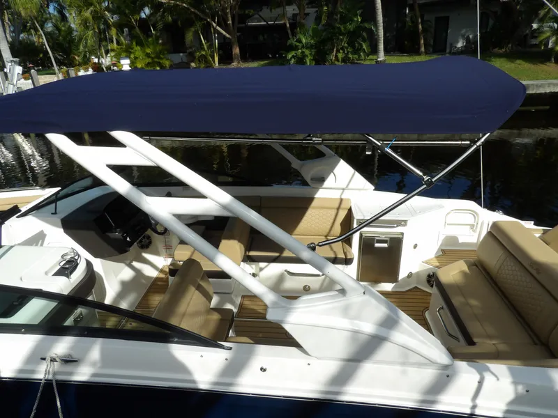 Slide: The Image of 2022 Sea Ray SDX 290 Outboard boat with canopy and spacious seating. - 9