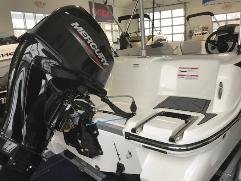 Slide: The Image of 2025 Bayliner M15 boat with Mercury outboard motor in showroom. - 10
