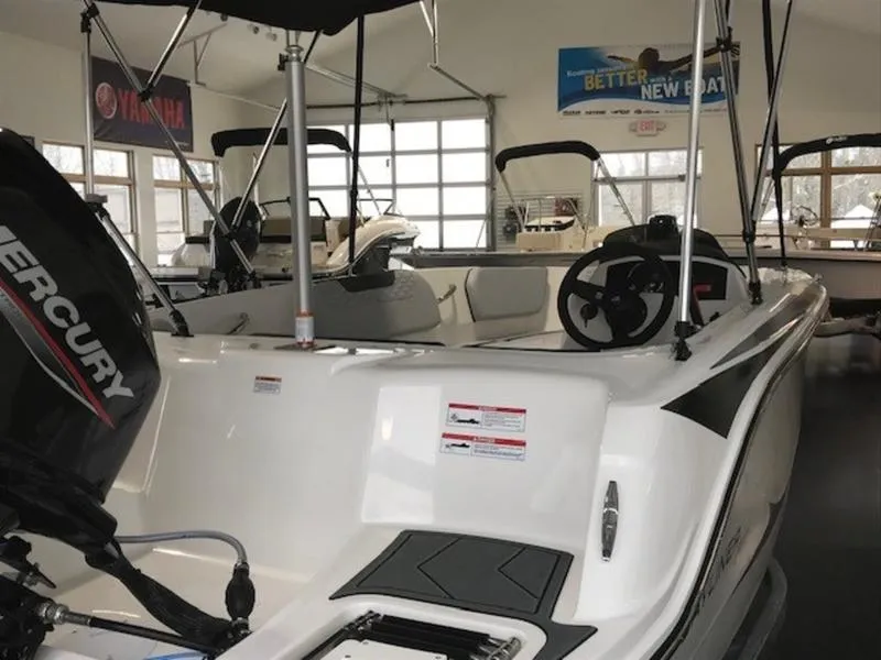 Slide: The Image of 2025 Bayliner M15 boat with Mercury engine in showroom. - 11
