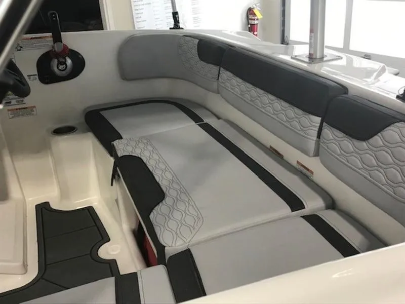 Slide: The Image of Interior seating of 2025 Bayliner M15 boat with modern design and gray upholstery. - 6