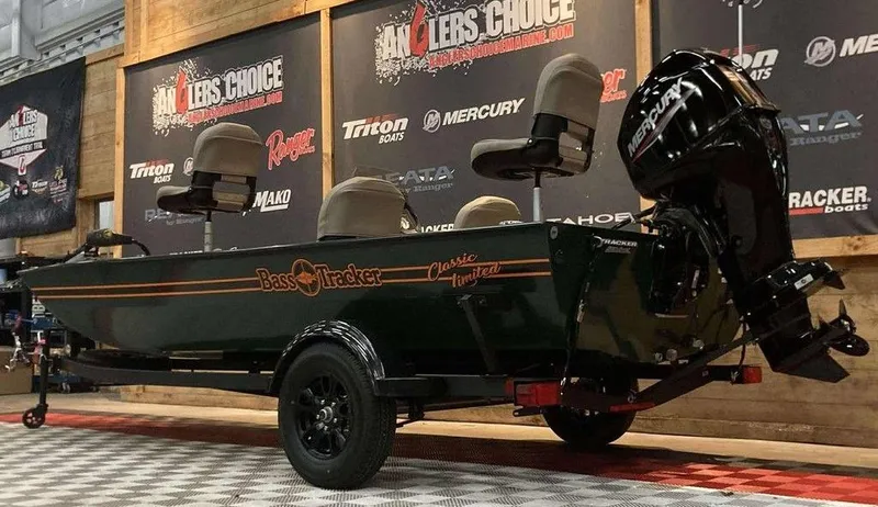 Slide: The Image of 2025 Tracker Bass Tracker Classic Limited boat interior with steering console and seating. - 5