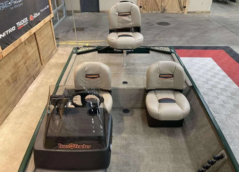 Slide: The Image of 2025 Tracker Bass Tracker Classic Limited boat on display with Mercury engine. - 6