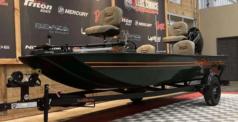 Slide: The Image of 2025 Tracker Bass Tracker Classic Limited dashboard with steering wheel and fishfinder. - 7