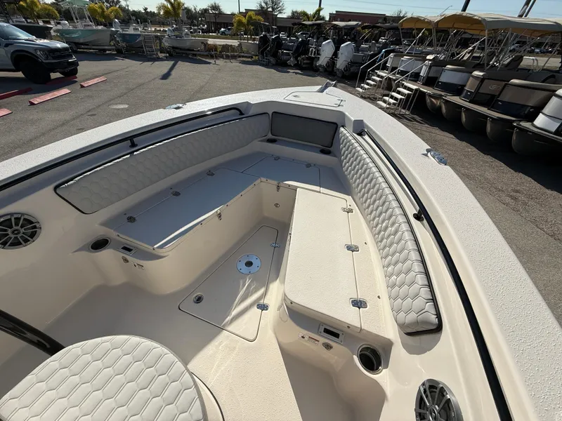 Slide: The Image of 2025 Sea Chaser 22 HFC boat interior with cushioned seating and storage compartments. - 17