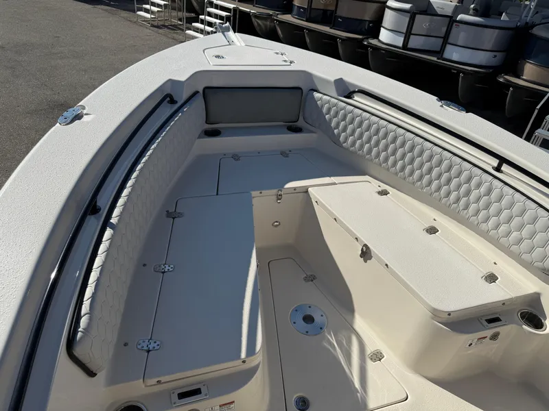 Slide: The Image of 2025 Sea Chaser 22 HFC boat interior with cushioned seating and storage compartments. - 19