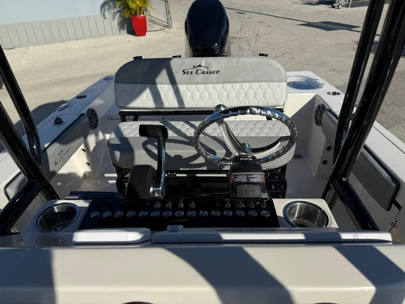 Slide: The Image of 2025 Sea Chaser 22 HFC boat cockpit with steering wheel and controls. - 20