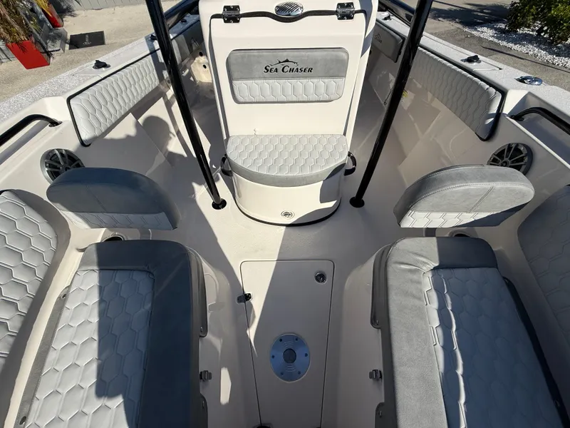 Slide: The Image of 2025 Sea Chaser 22 HFC boat interior with gray seating and modern design. - 29