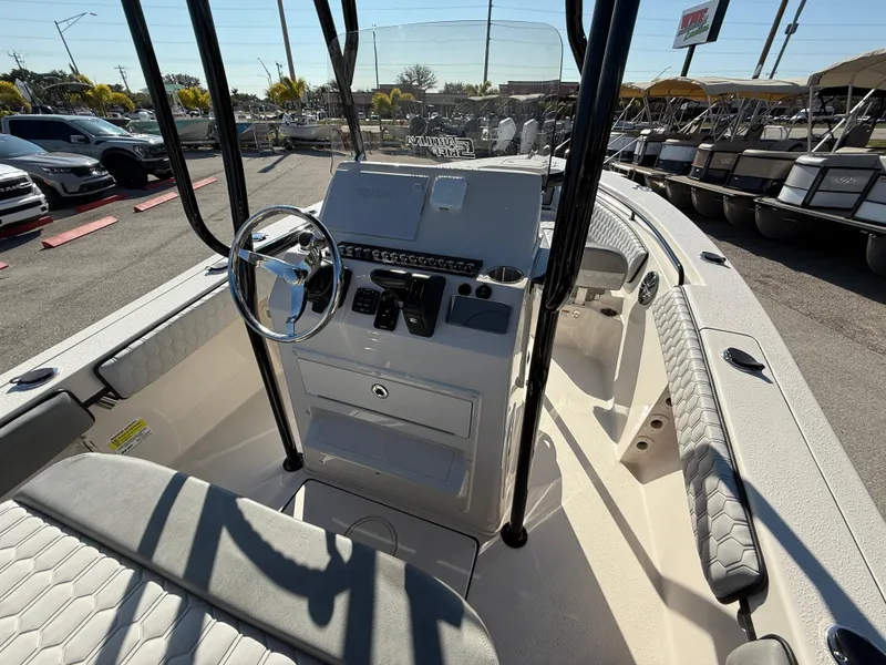 Slide: The Image of 2025 Sea Chaser 22 HFC boat interior with steering console and seating. - 34