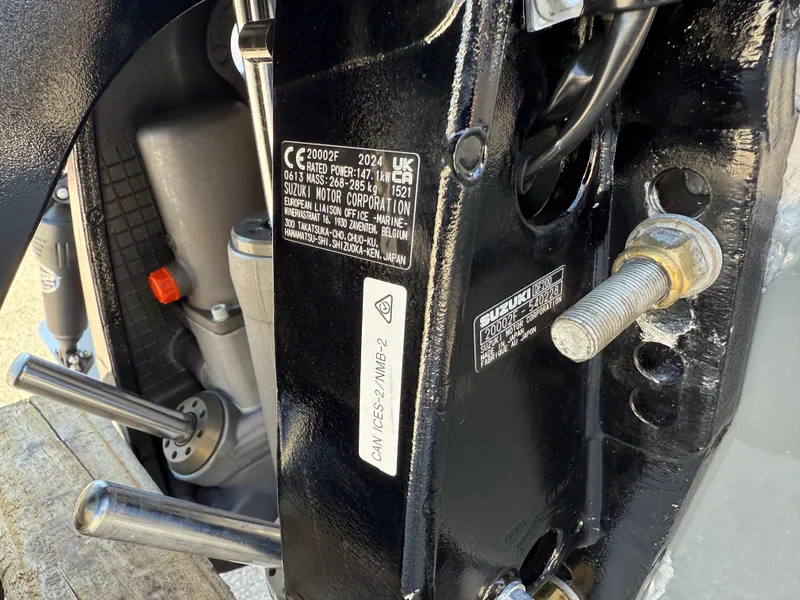 Slide: The Image of Close-up of a 2025 Sea Chaser 22 HFC engine mount with visible labels and bolts. - 36