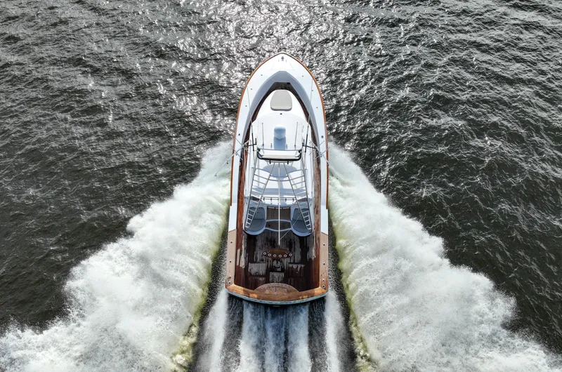 Slide: The Image of Aerial view of 2008 Custom Carolina 45 F&S yacht cruising on open water. - 12