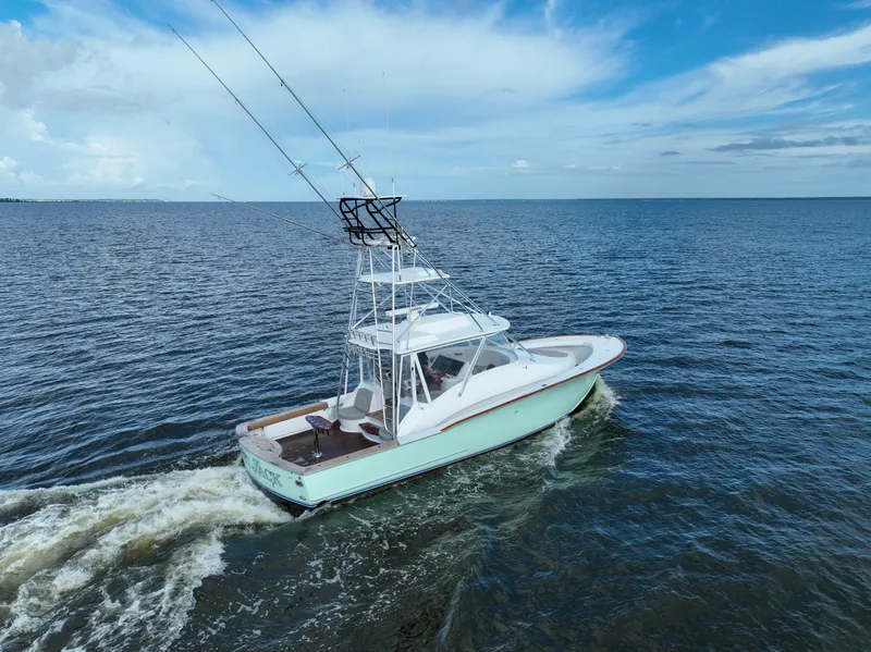 Slide: The Image of Custom Carolina 45 F&S 2008 boat cruising on open water under a blue sky. - 17