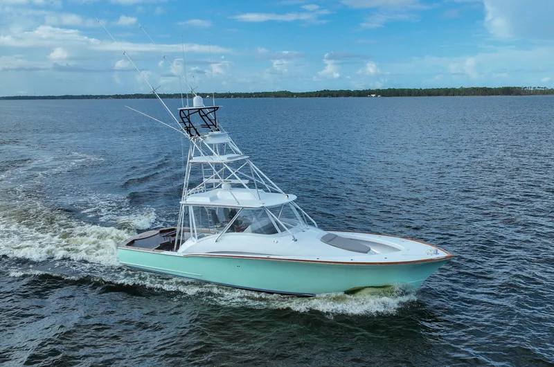 Slide: The Image of 2008 Custom Carolina 45 F&S yacht cruising on open water. - 19