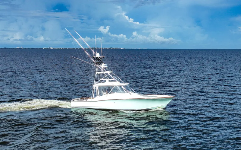 Slide: The Image of Custom Carolina 45 F&S 2008 yacht cruising on open sea under clear blue sky. - 2