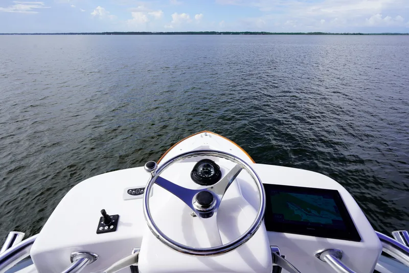 Slide: The Image of Custom Carolina 45 F&S 2008 boat helm overlooking calm waters. - 27