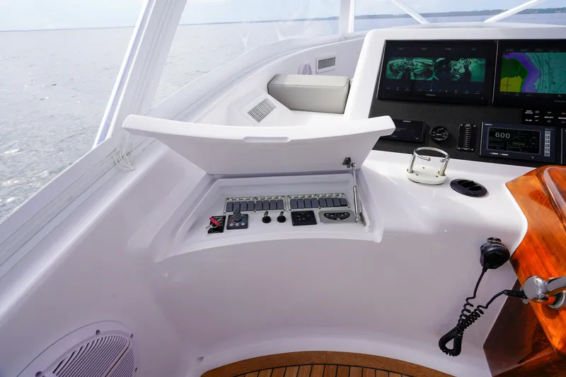 Slide: The Image of 2008 Custom Carolina 45 F&S yacht helm with navigation screens and control panel. - 31
