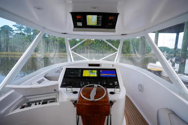 Slide: The Image of Interior helm of 2008 Custom Carolina 45 F&S boat with navigation equipment. - 32