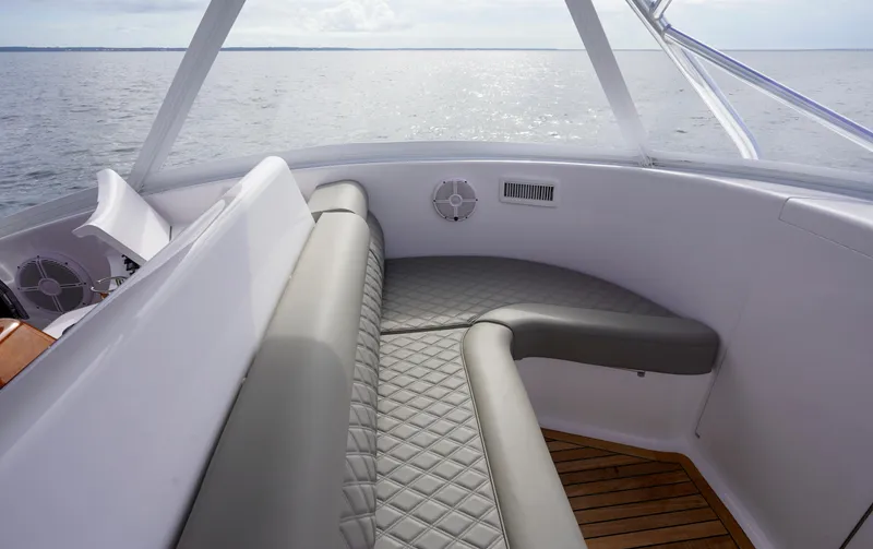 Slide: The Image of Custom Carolina 45 F&S 2008 boat interior with cushioned seating and ocean view. - 36