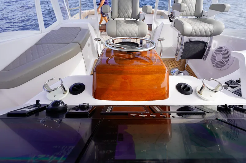 Slide: The Image of Custom Carolina 45 F&S 2008 boat helm with polished wood and modern controls. - 37