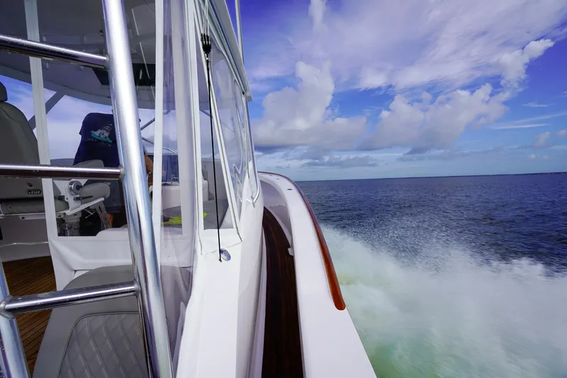 Slide: The Image of Custom Carolina 45 F&S 2008 boat cruising on open water under a blue sky. - 38