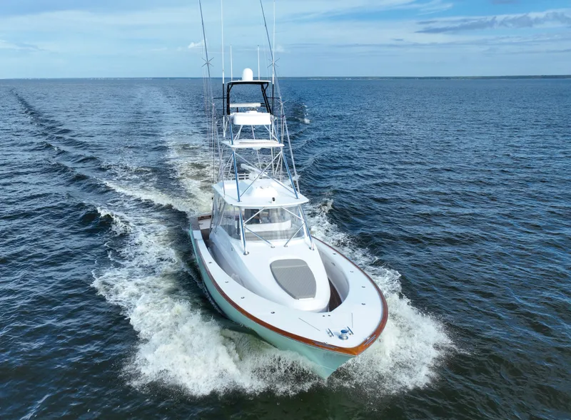 Slide: The Image of 2008 Custom Carolina 45 F&S boat cruising on open water. - 4