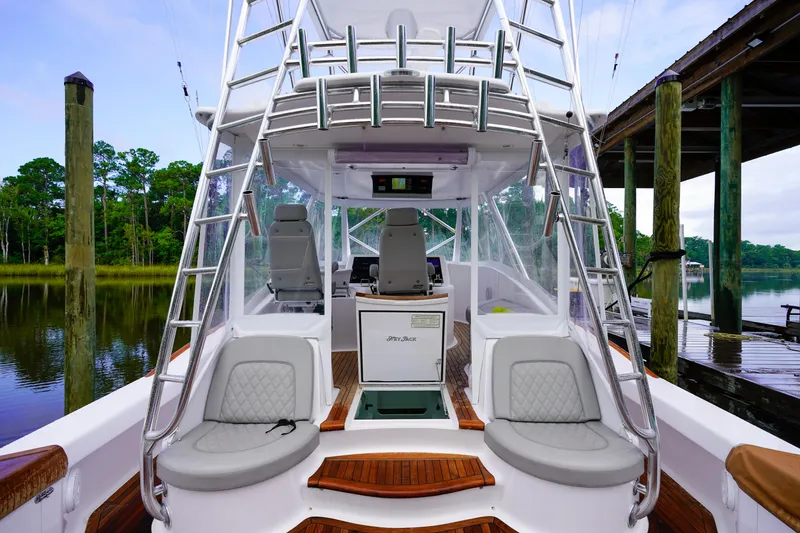 Slide: The Image of 2008 Custom Carolina 45 F&S boat interior with seating and helm station. - 40