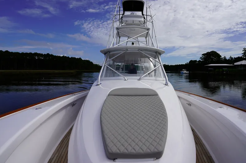 Slide: The Image of 2008 Custom Carolina 45 F&S boat on calm water under a partly cloudy sky. - 43