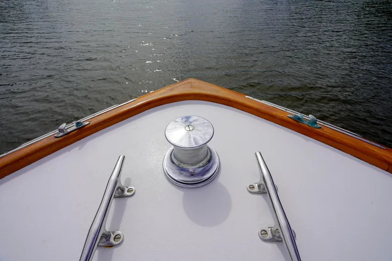Slide: The Image of Bow of 2008 Custom Carolina 45 F&S boat on calm water. - 46