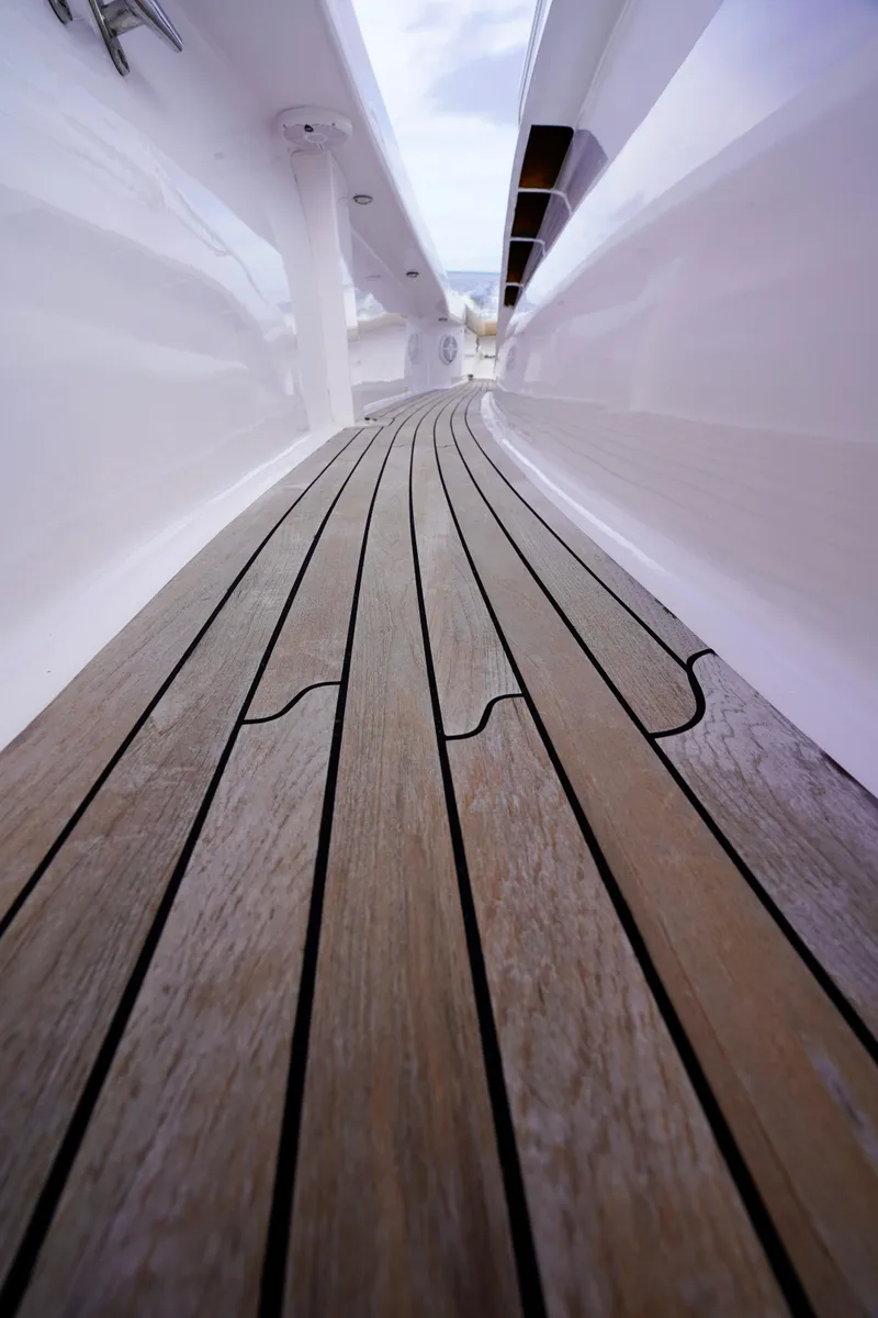 Slide: The Image of Custom Carolina 45 F&S 2008 boat deck with sleek wooden flooring. - 48