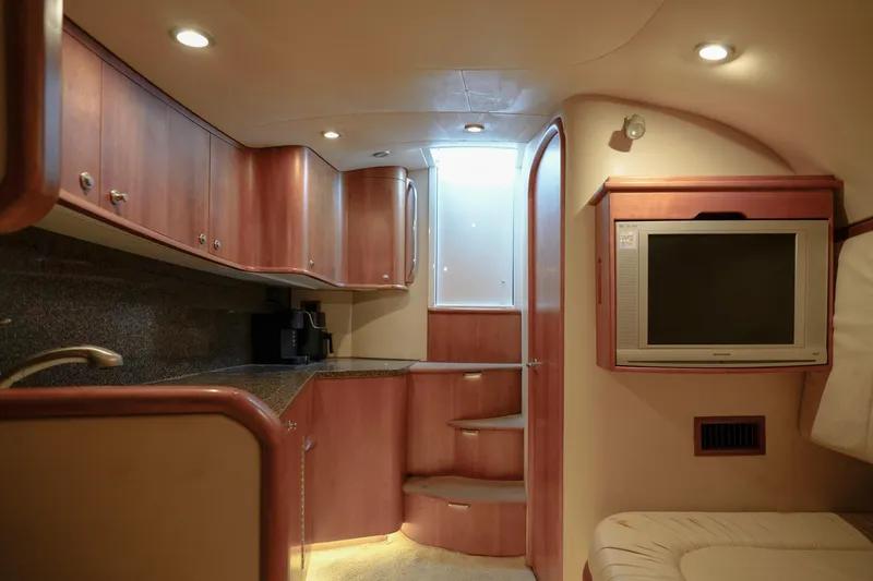 Slide: The Image of Luxurious interior of 2008 Custom Carolina 45 F&S yacht with wood cabinetry and modern amenities. - 49