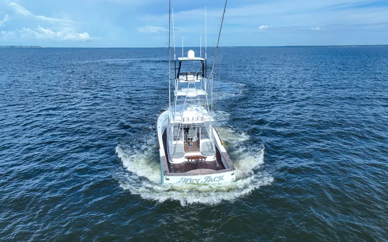 Slide: The Image of Custom Carolina 45 F&S 2008 boat cruising on open water, rear view. - 8