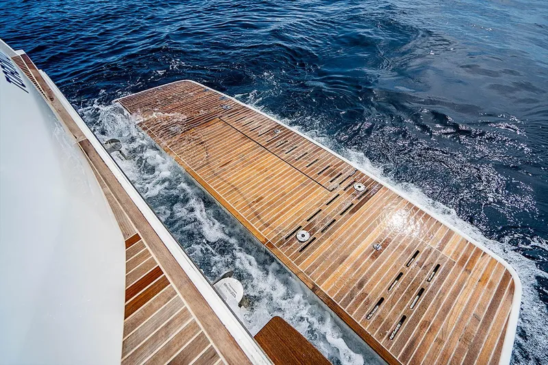 Slide: The Image of Beneteau GRAN TURISMO 2017 yacht with wooden swim platform on open water. - 14