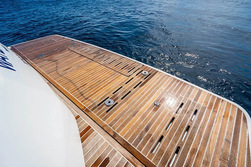Slide: The Image of 2017 Beneteau GRAN TURISMO yacht with wooden deck on calm water. - 16