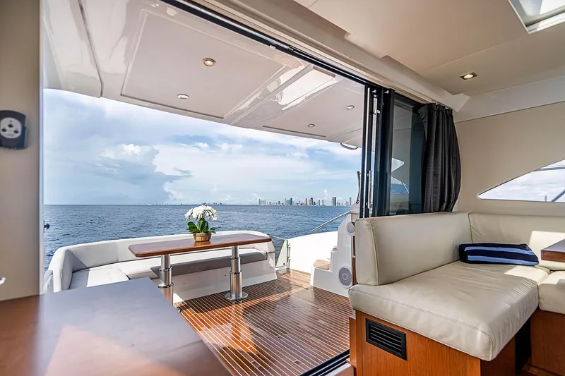 Slide: The Image of Luxurious 2017 Beneteau Gran Turismo yacht interior with ocean view and elegant seating area. - 17