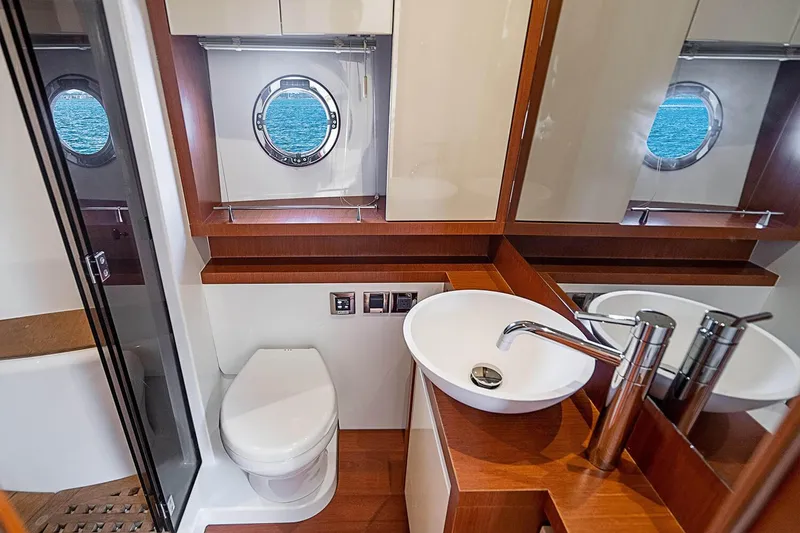Slide: The Image of Luxury bathroom in 2017 Beneteau Gran Turismo yacht with modern fixtures and porthole view. - 27
