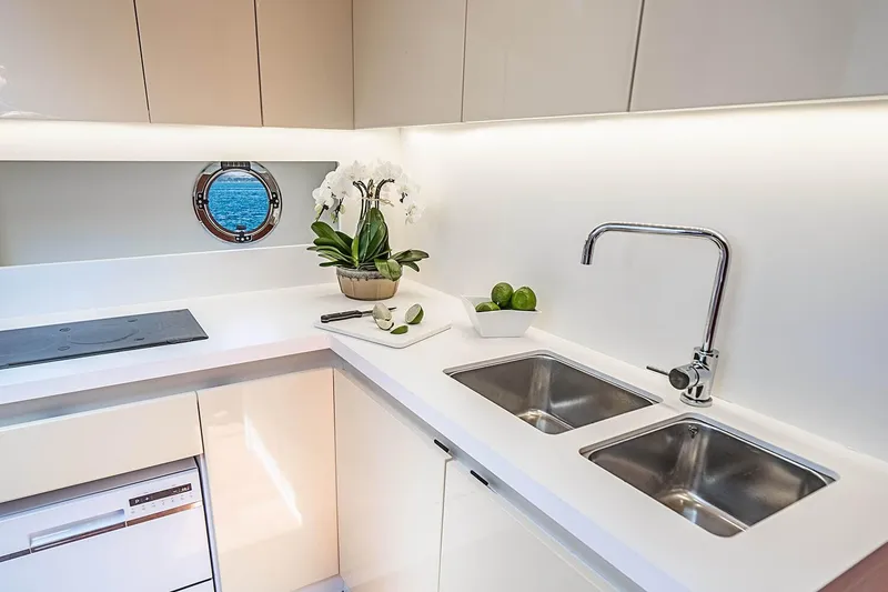 Slide: The Image of Modern kitchen interior on 2017 Beneteau GRAN TURISMO yacht with dual sinks and ocean view. - 28