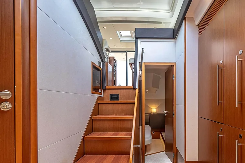 Slide: The Image of Interior of 2017 Beneteau Gran Turismo yacht, featuring wooden stairs and modern design elements. - 30