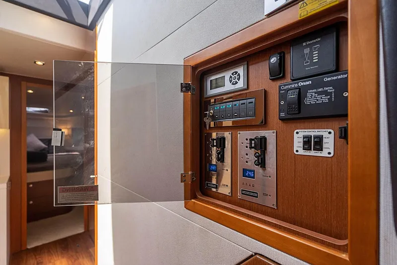 Slide: The Image of Control panel inside 2017 Beneteau GRAN TURISMO yacht, featuring various switches and displays. - 43