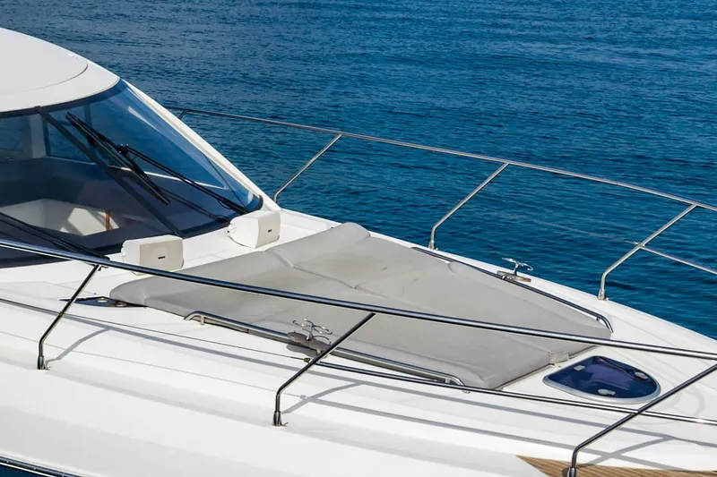 Slide: The Image of 2017 Beneteau GRAN TURISMO yacht with sleek design on calm blue water. - 5