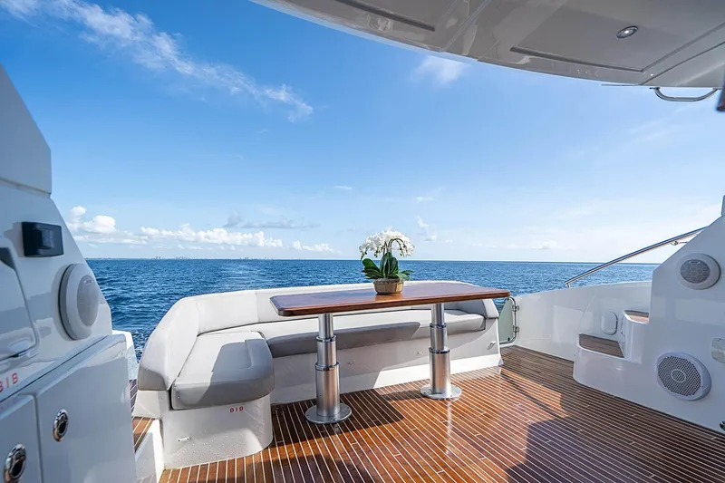 Slide: The Image of Luxury Beneteau Gran Turismo 2017 yacht deck with ocean view and elegant seating area. - 8