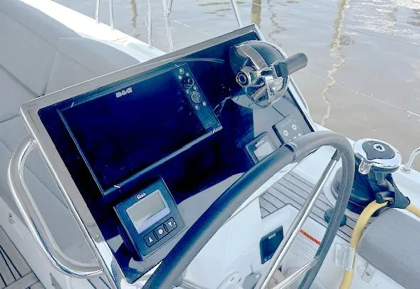 Slide: The Image of Steering console of 2022 Beneteau Oceanis 51.1 yacht with navigation equipment. - 10