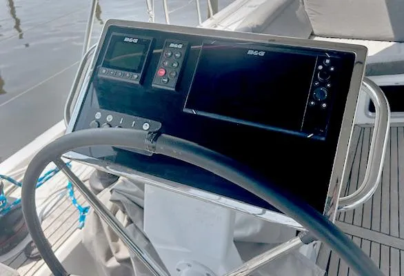 Slide: The Image of Steering console of 2022 Beneteau Oceanis 51.1 yacht with navigation instruments. - 11