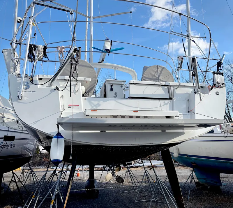 Slide: The Image of Beneteau Oceanis 51.1 sailboat, 2022 model, on dry dock with clear blue sky. - 16