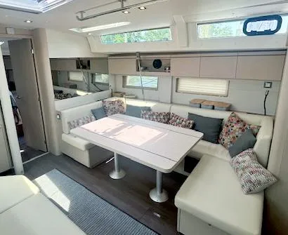 Slide: The Image of Luxurious interior of 2022 Beneteau Oceanis 51.1 yacht with modern seating and dining area. - 17